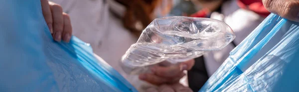 Plastic Cup Falling Trash Bag Blurred Volunteers Banner — Stock Photo, Image