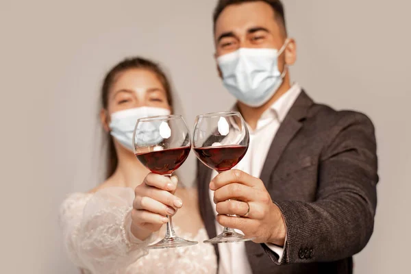 Selective Focus Glasses Red Wine Hands Newlyweds Medical Masks Isolated — Foto de Stock