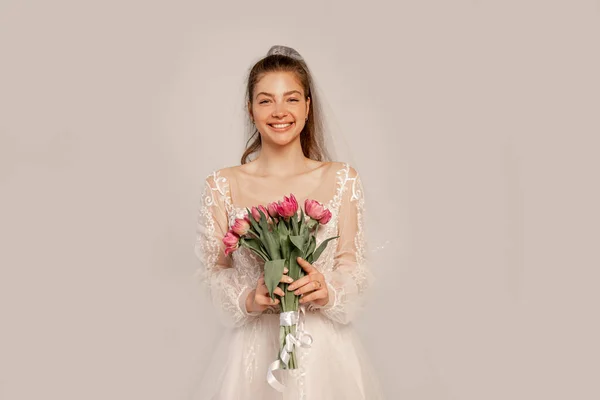 Cheerful Bride Bouquet Tulips Looking Camera Isolated Grey — Stock Photo, Image