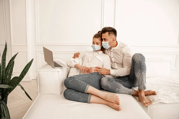 Man Medical Mask Hugging Girlfriend While Watching Movie Laptop — Stock Photo, Image