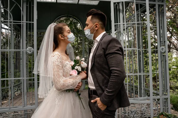 Side View Young Bride Groom Medical Masks Looking Each Other — Stock Photo, Image