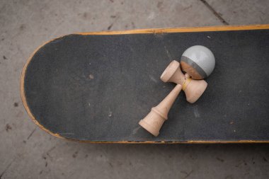 top view of assembled kendama game on skateboard clipart