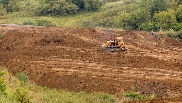 Žlutý stavební buldozer v práci Royalty Free Stock Fotografie