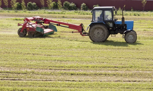 Tractor mowing the meadow — Stock Photo, Image