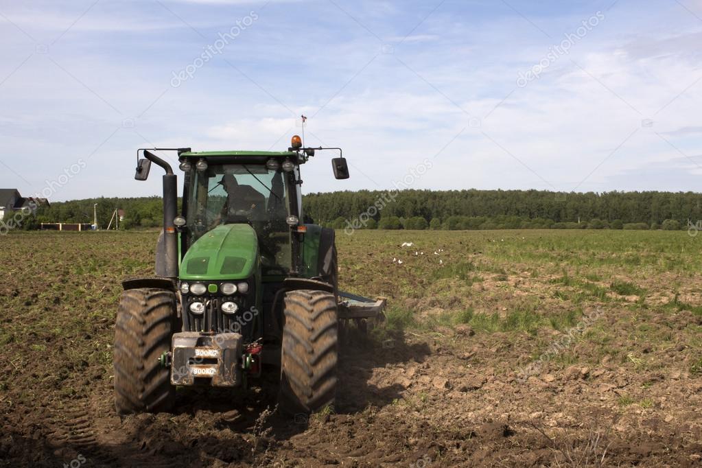 Tractor plows a field