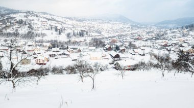 winter view of the town of ceceu, romania