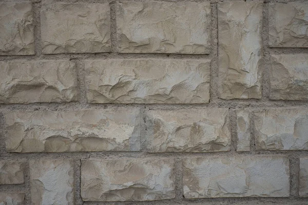 ライトベージュ色の異なるサイズの天然石の壁 テキストを挿入するために使用できる背景またはテクスチャ — ストック写真