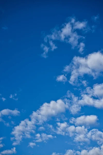 Blue sky and white cotton clouds. Background to convey calm, peace, freedom, fly. Free space to insert text