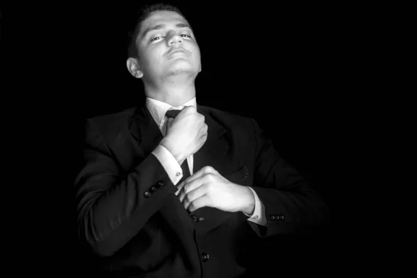 Portrait Shot Businessman Adjusting His Tie Meeting Isolated Black Background — Stock Photo, Image