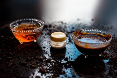 Face mask for bright skin and unclog pores on the black surface 