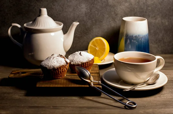 Tea drinking. We drink tea, we eat muffins. A lemon will come in handy.