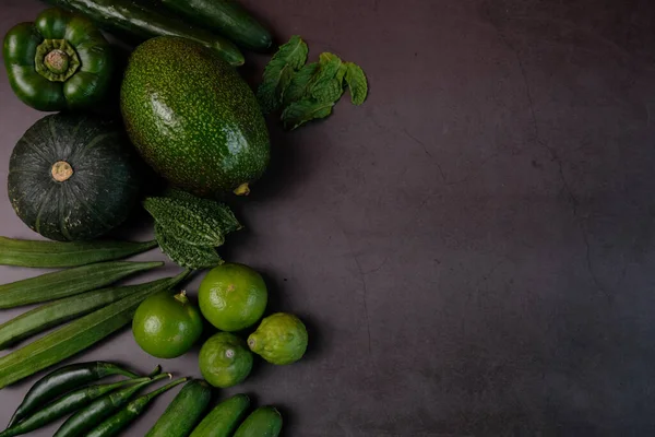 Green vegetables are good for the body. Green vegetables are placed on the table, viewed from above.