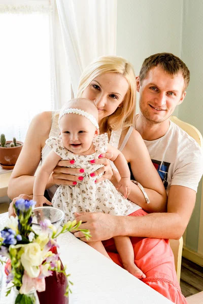 Happy young family spending time outdoors on a summer day.