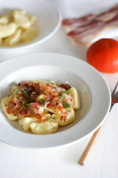 Delicious and tender lazy dumplings with bacon. Unsweetened lazy dumplings.