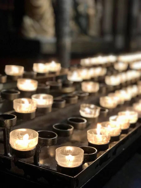 Lights of votive candles in European Catholic church