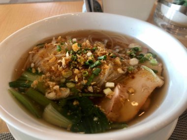 Thai pork and noodle soup served as breakfast