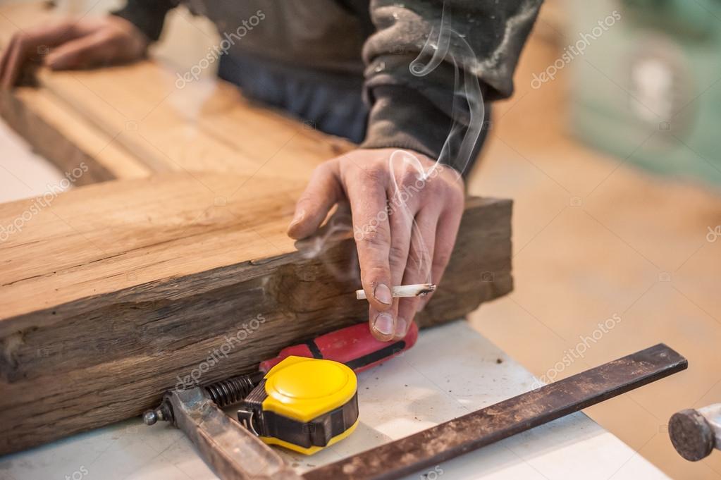 Carpenter with cigarette Stock Photo by ©guruxox 105045610