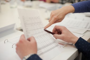 Businessman working with documents clipart