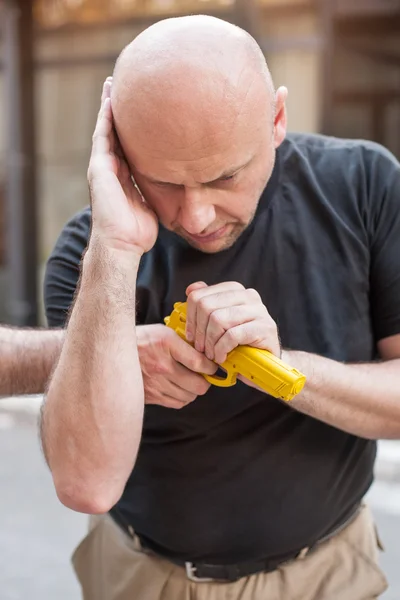 Gun Disarm. Self defense techniques against a gun point. — Stock Photo, Image