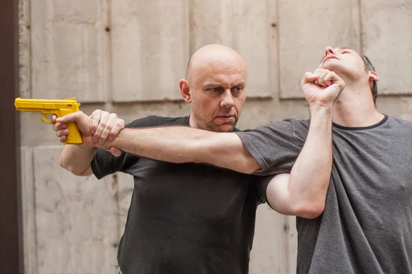 Gun Disarm. Self defense techniques against a gun point. — Stock Photo, Image