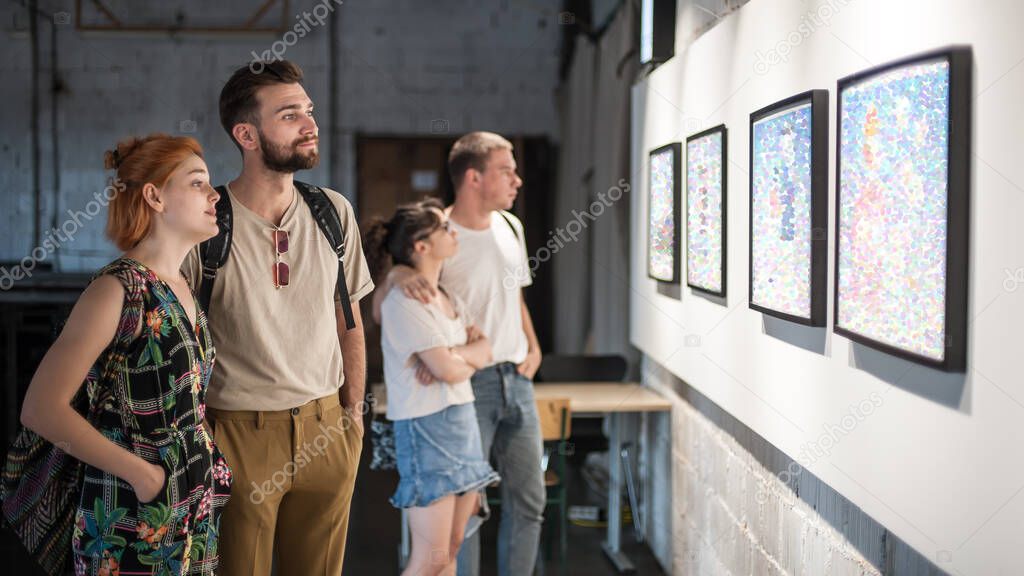 Group of friends in modern art exhibition gallery hall contemplating artwork. Abstract painting