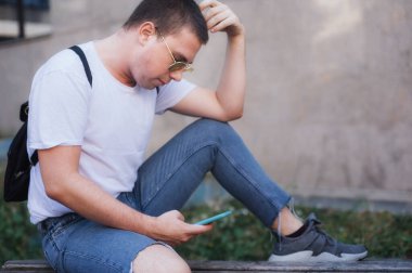 Man using smart phone connect communication. Young people addiction to new technology trends. Youth, new generation internet friendship concept. Emotional isolation and depresion