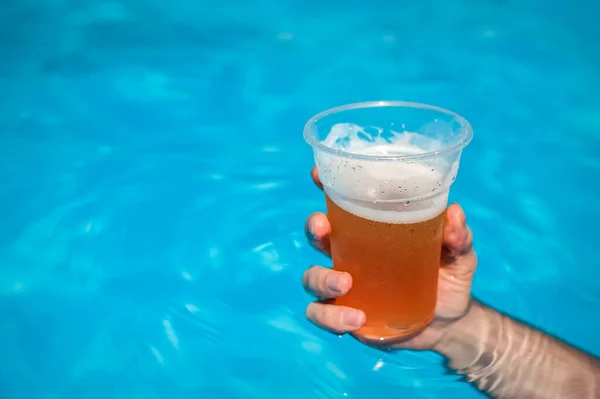 Close Man Hand Holding Pint Beer Swimming Pool — Stock Photo, Image