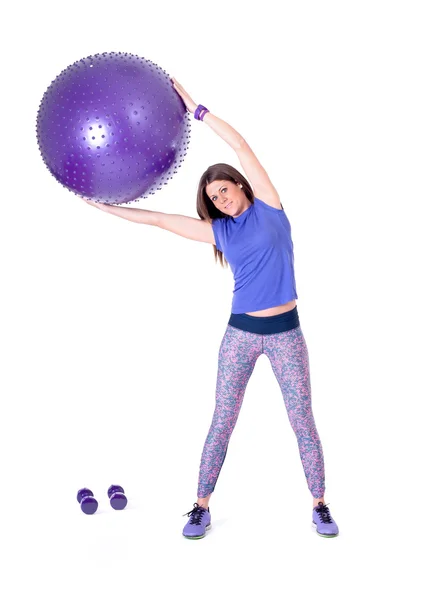 Ejercicio de mujer con una pelota de pilates —  Fotos de Stock