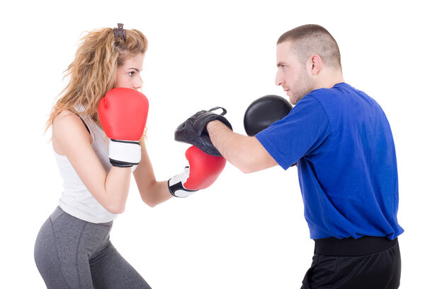 Kickboxing girl with trainer in sparring