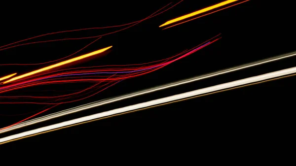 Night road lights. Lights of moving cars at night. long exposure multicolored