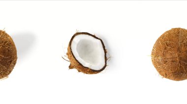 Tropical summer coconut background. half and whole coconuts yellow and white background