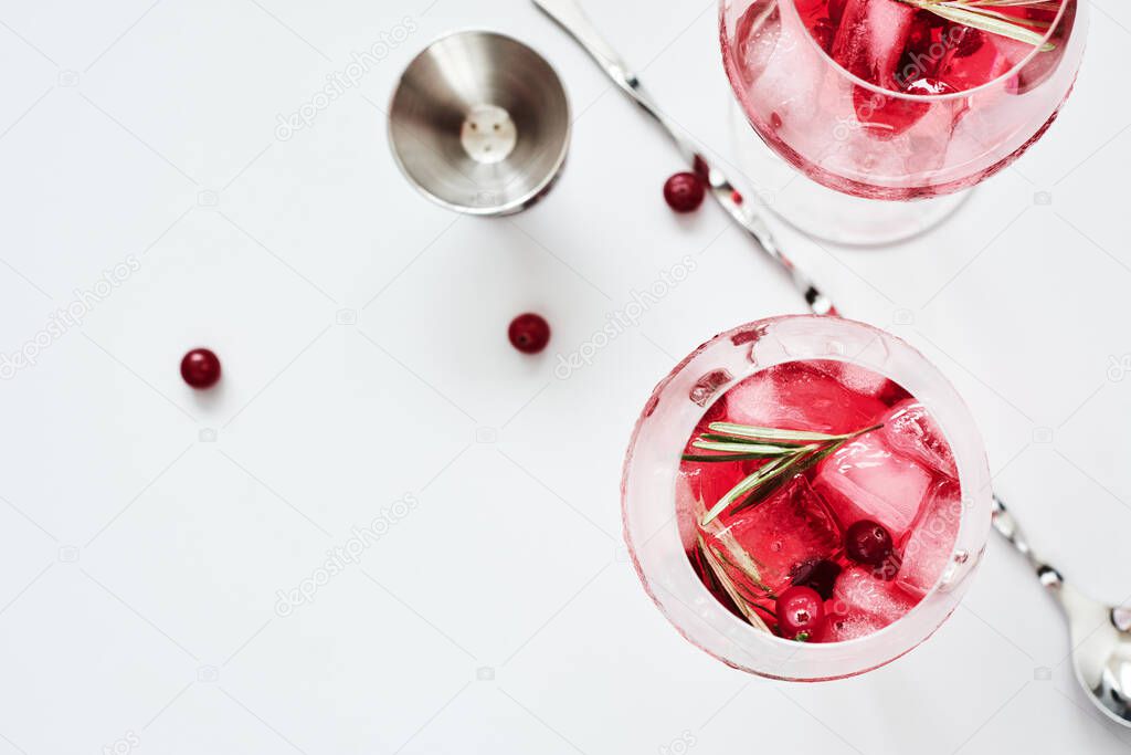 Cranberry rosemary spritzer drink on a light background.