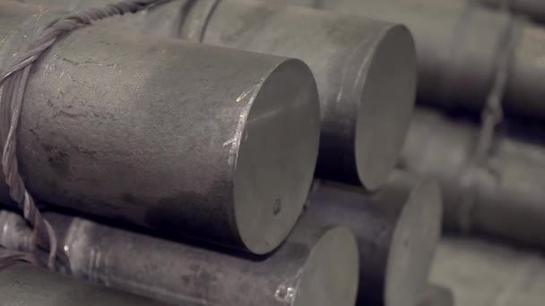 Close-up of a section of steel pipes stacked on top of each other. conveyor production of iron products — Stock Video