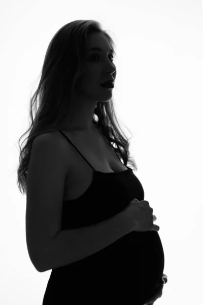 Silhouette de femme enceinte sur fond blanc Images De Stock Libres De Droits