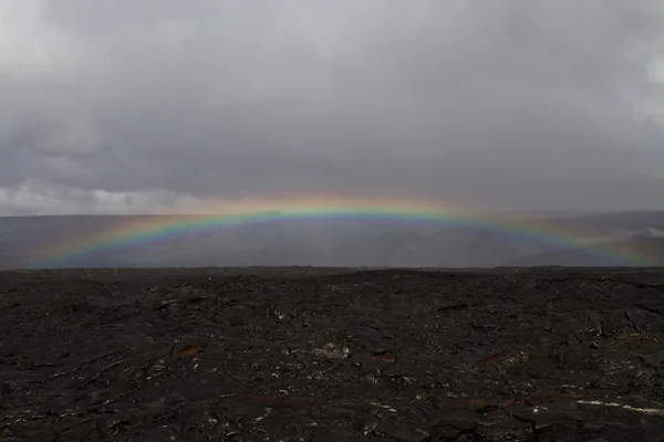 Rainbow over a lava field in Hawaii — Stock Photo, Image