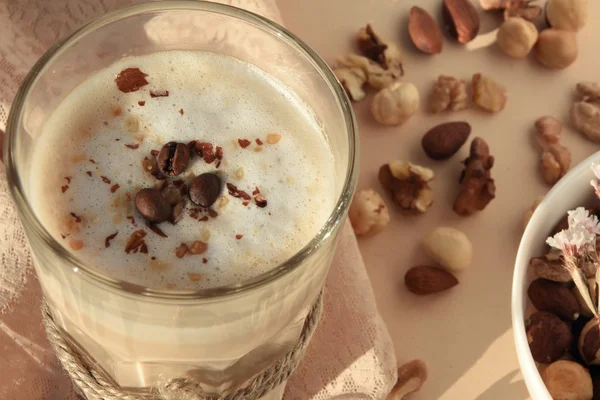 Photo of fresh coffee latte with nuts. — Stock Photo, Image
