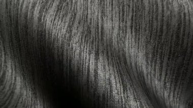 Gri kot kumaş dalgaları yumuşak sakin canlılar için mükemmel kıvrımlar oluşturuyor.