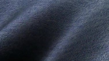 Mavi kot tekstil dalgaları, temiz modern grafikler için özel bir arkaplan ile nazik bir hareketle yer değiştiriyor.