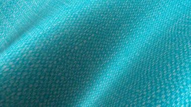 Mavi pamuk kumaş dalgaları parlak katmanlı animasyon oluşturuyor. Temiz tekstil görselleri için mükemmel bir arka plan.