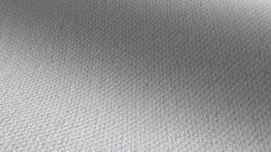 Temiz beyaz boya bezi, ince dokuma ve doku dalgaları içerir.