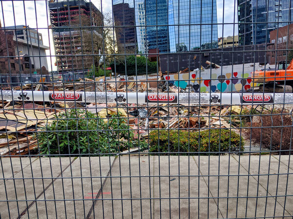 Bellevue, WA / USA - circa December 2019: View of asbestos warning signs at the Turner Construction project at 555 108th Avenue NE in downtown near the Bellevue transit center.