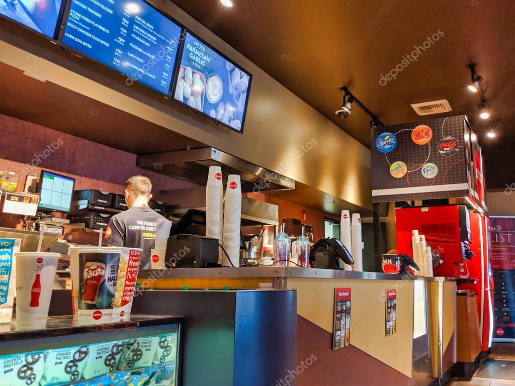 Woodinville, WA / USA - November 2nd, 2019: AMC movie theater foyer with ticket stand and refreshment counter.