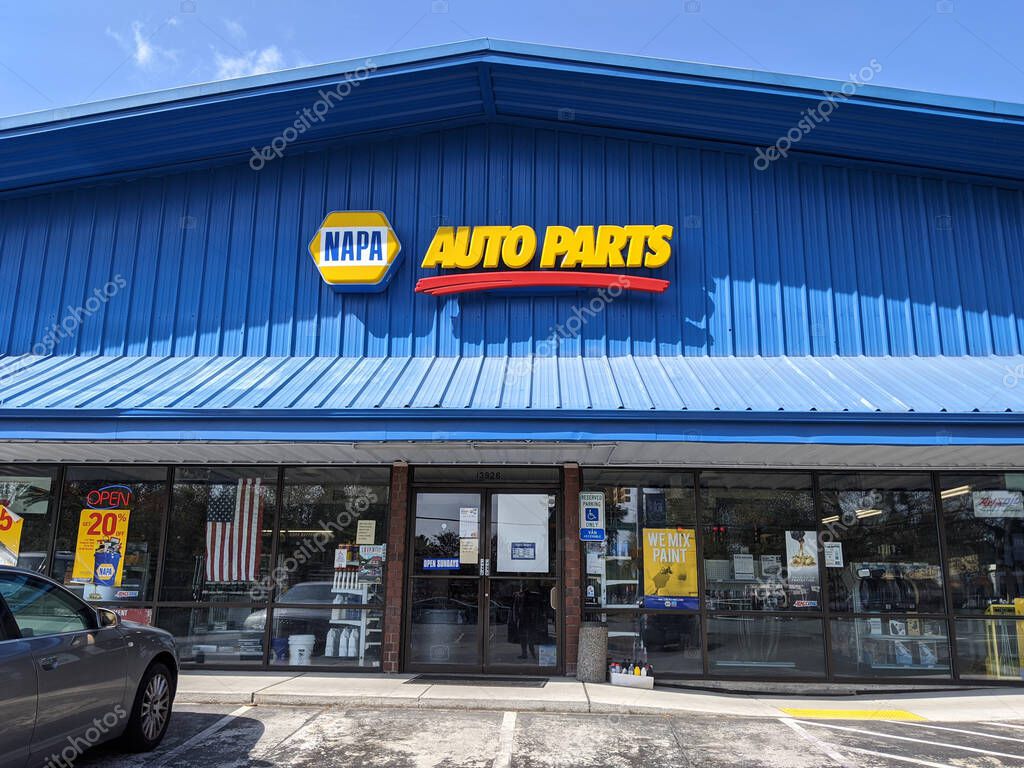 Woodinville, WA / USA - circa April 2020: Street view of a NAPA Auto Part store on a sunny day.
