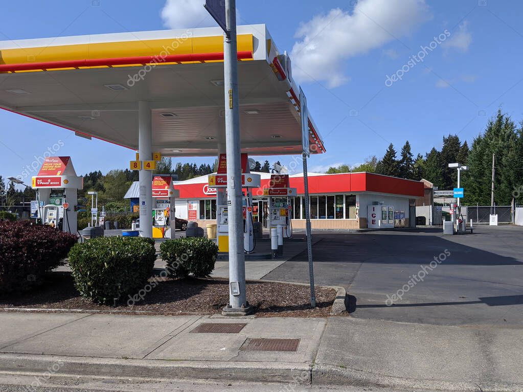 Woodinville, WA / USA - circa April 2020: Street view of a Shell gas pumping station on a clear sunny day in the pacific northwest