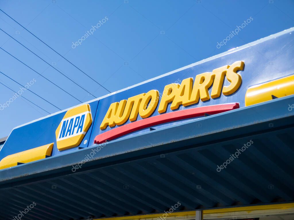 Snohomish, WA USA - circa April 2021: Low angle view of a Napa Auto Parts Center on a bright sunny day.