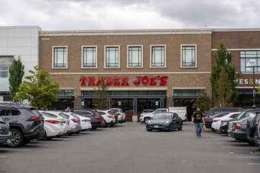 Kirkland, WA USA - circa July 2021: Exterior view of a Trader Joe's grocery store on an overcast day. clipart