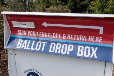 Tacoma, WA USA - circa August 2021: Close up of a Ballot Drop Box outside of a police station in downtown Tacoma. clipart