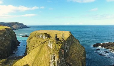 Dunluce Castle Co Antrim Northern Ireland blue sea background  clipart