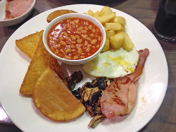 Irish Breakfast Fry with egg chips beans bacon soda bread mushro