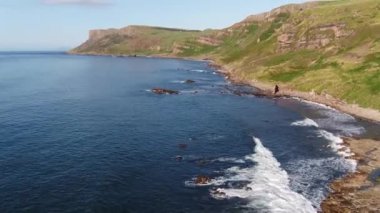 Aerial video of Fair Head Atlantic Ocean Co Antrim Coastline Northern Ireland